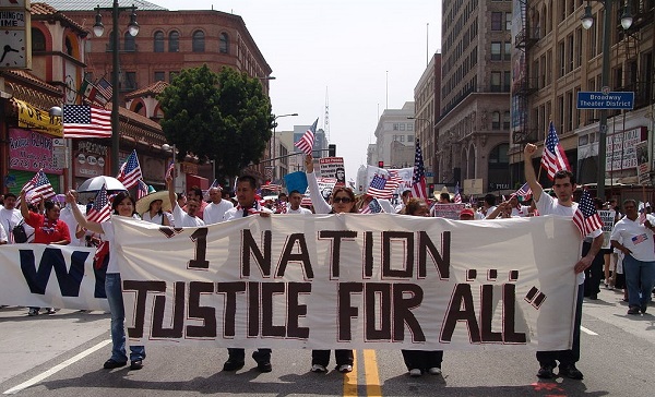 Immigrant-rights advocates march in downtown Los Angeles on May Day, 2006. This image is the backdrop of the #ImmigrationSyllabus homepage. Jonathan McIntosh/via Wikimedia Commons 